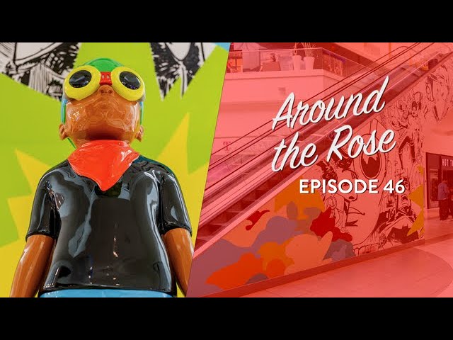 A colorful statue with goggles and a red scarf stands beside an escalator with Around the Rose Episode 46 text overlayed on the image.