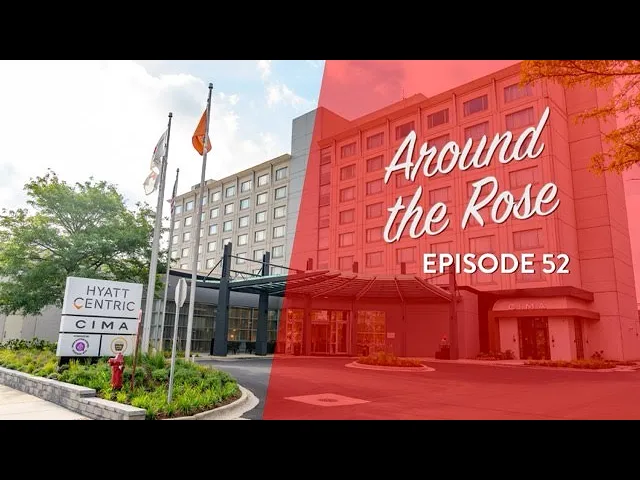 Front view of the Hyatt Centric hotel with flags, landscaping, and a sign reading “CIMA” alongside text overlay: “Around the Rose Episode 52.”.