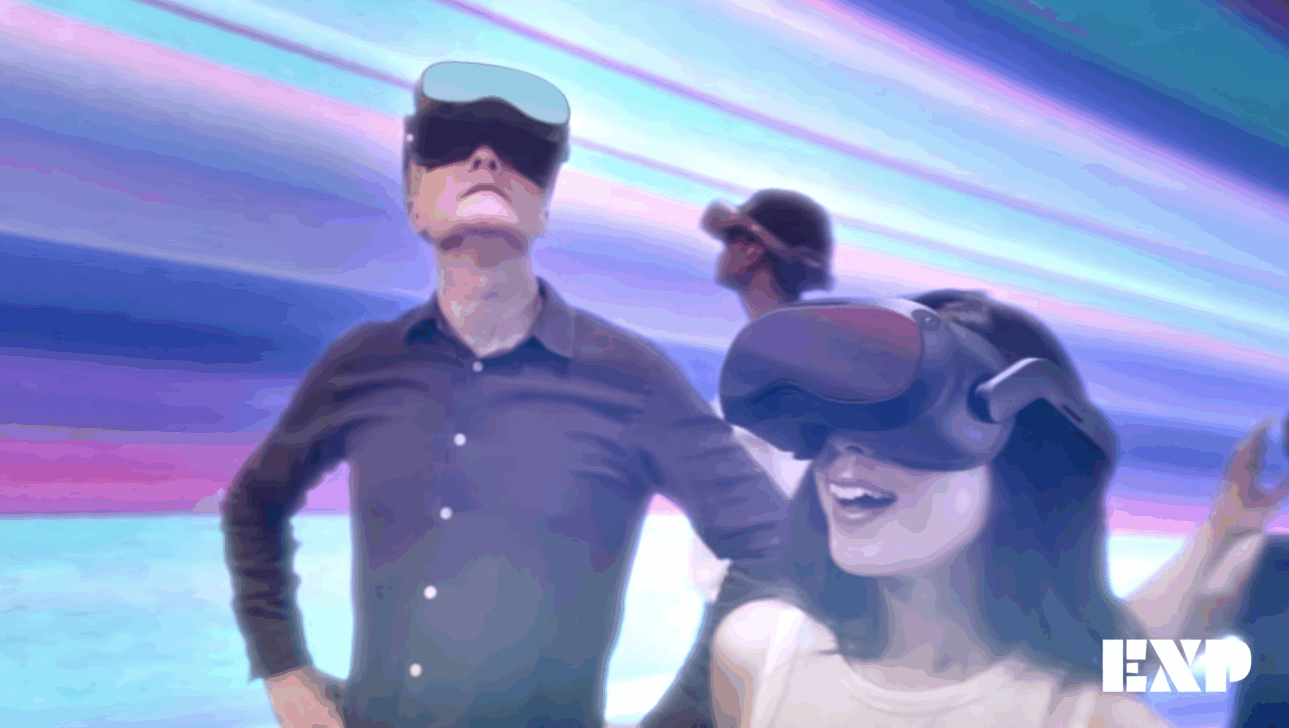 Three people wearing virtual reality headsets stand in a colorful, futuristic setting. Logo EXP is visible in the bottom right corner.