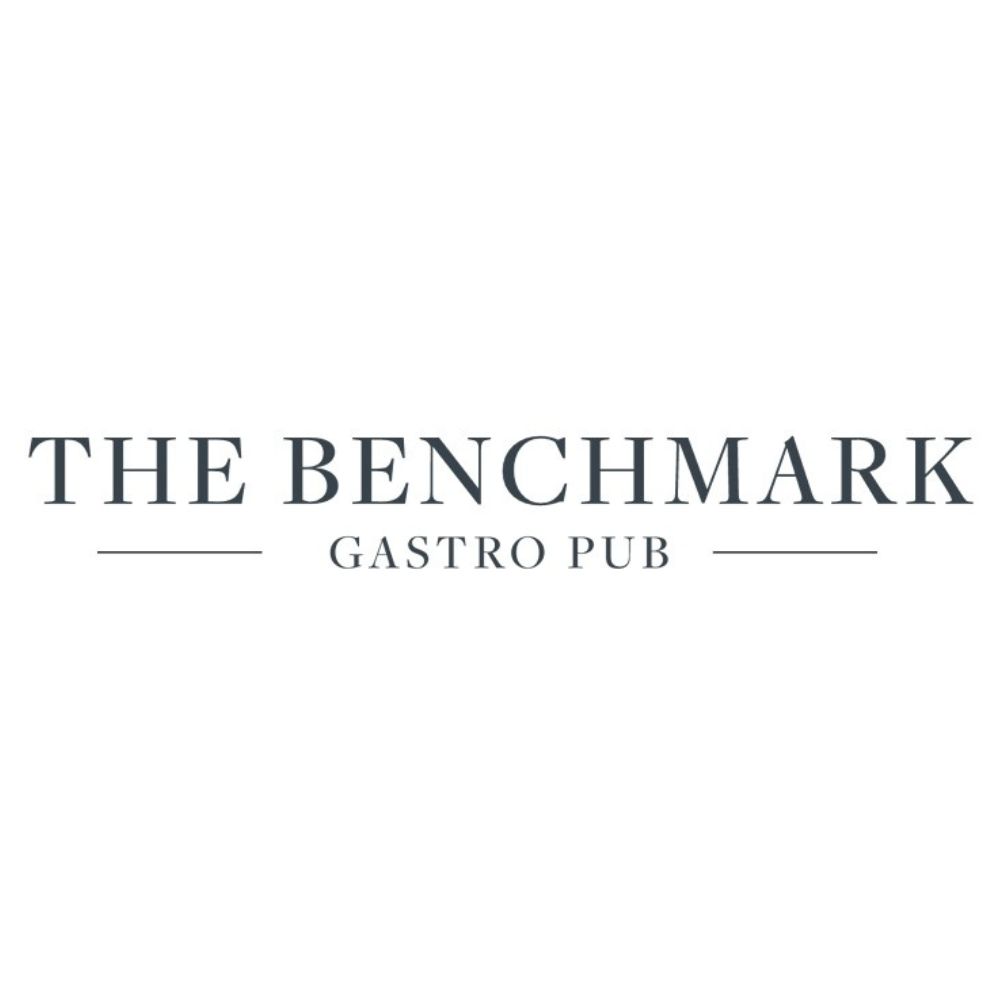The image displays the logo for The Benchmark Gastro Pub, featuring the establishments name in uppercase serif font on a plain white background.