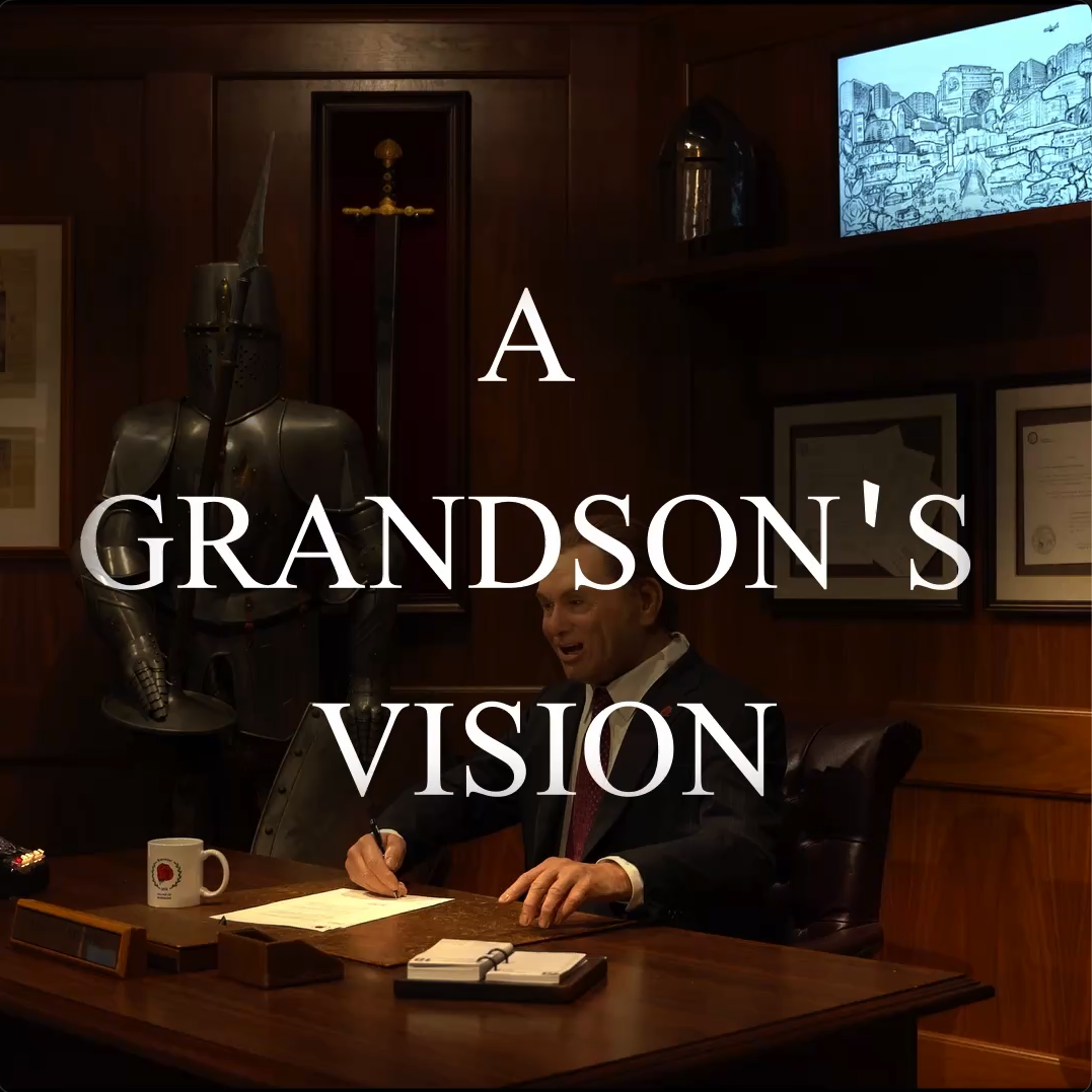A man in a suit sits at a desk writing, with a suit of armor and a sword behind him. Papers and a computer monitor are visible. Large text reads A GRANDSONS VISION..